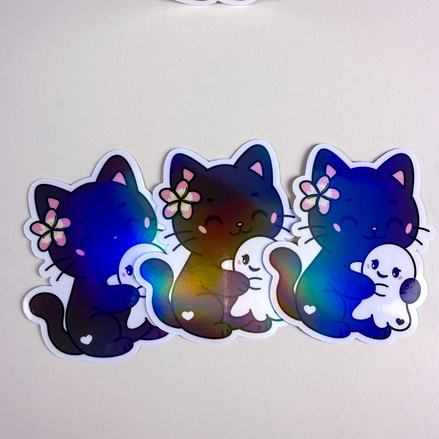 Cozy Cat Hugging Ghost Vinyl Holographic Sticker